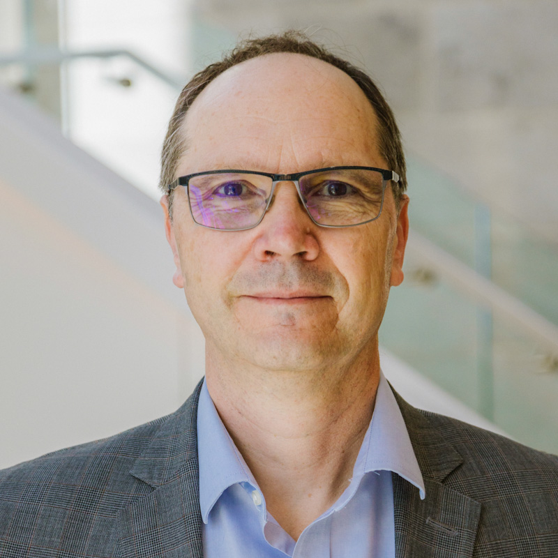 Portrait photograph of Pascal Hubert smiling.